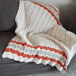 Beautiful hand crocheted 50" X60"taupe afgan accentedw/soft green & Terra cotta.